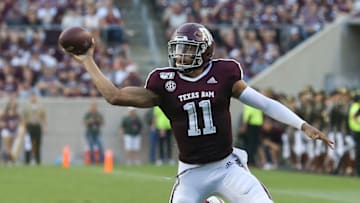 COLLEGE STATION, TEXAS - SEPTEMBER 14: Kellen Mond #11 of the Texas A&M Aggies dumps a pass off before Andre Mulinax #22 of the Lamar Cardinals can make the tackle during the first half at Kyle Field on September 14, 2019 in College Station, Texas. (Photo by Bob Levey/Getty Images)