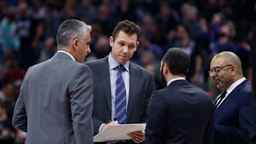 SACRAMENTO, CALIFORNIA - DECEMBER 11: Luke Walton (second from left) head coach of the Sacramento Kings talks with his assistant coaches during a timeout in the second half against the Oklahoma City Thunder at Golden 1 Center on December 11, 2019 in Sacramento, California. NOTE TO USER: User expressly acknowledges and agrees that, by downloading and/or using this photograph, user is consenting to the terms and conditions of the Getty Images License Agreement. NOTE TO USER: User expressly acknowledges and agrees that, by downloading and/or using this photograph, user is consenting to the terms and conditions of the Getty Images License Agreement. (Photo by Lachlan Cunningham/Getty Images)