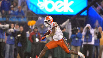CHARLOTTE, NC - DECEMBER 01: Travis Etienne #9 of the Clemson Tigers runs against the Pittsburgh Panthers during the second quarter of their game at Bank of America Stadium on December 1, 2018 in Charlotte, North Carolina. (Photo by Grant Halverson/Getty Images)
