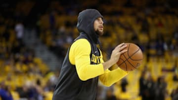 OAKLAND, CA - APRIL 16: Stephen Curry #30 of the Golden State Warriors warms up before their game against the San Antonio Spurs in Game 2 of Round 1 of the 2018 NBA Playoffs at ORACLE Arena on April 16, 2018 in Oakland, California. Curry is still out with an injury. NOTE TO USER: User expressly acknowledges and agrees that, by downloading and or using this photograph, User is consenting to the terms and conditions of the Getty Images License Agreement. (Photo by Ezra Shaw/Getty Images)