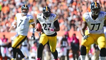 Oct 12, 2014; Cleveland, OH, USA; Pittsburgh Steelers running back LeGarrette Blount (27) runs with the ball during the second quarter against the Cleveland Browns at FirstEnergy Stadium. Mandatory Credit: Andrew Weber-USA TODAY Sports