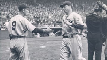UNSPECIFIED - UNDATED: Joe DiMaggio being congratulated after hitting a home run at Yankee Stadium in this undated photo. (Photo by Sports Studio Photos/Getty Images)