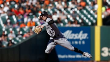 SAN FRANCISCO, CA - SEPTEMBER 16: Trevor Story #27 of the Colorado Rockies throws to first base to get the out of Brandon Crawford #35 of the San Francisco Giants in the bottom of the eighth inning at AT&T Park on September 16, 2018 in San Francisco, California. (Photo by Lachlan Cunningham/Getty Images)