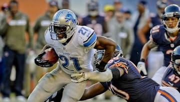 Nov 10, 2013; Chicago, IL, USA; Detroit Lions running back Reggie Bush (21) runs against Chicago Bears outside linebacker James Anderson (50) at Soldier Field. Mandatory Credit: Matt Marton-USA TODAY Sports