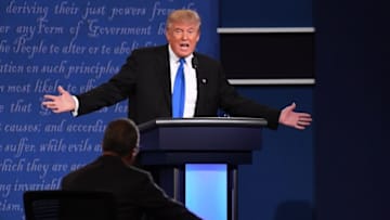 Sep 26, 2016; Hempstead, NY, USA; Debate moderator Lester Holt from NBC talks with Republican presidential candidate Donald Trump speaks on stage during the first presidential debate at Hofstra University. Mandatory Credit: Robert Deutsch-USA TODAY NETWORK