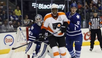 Sep 23, 2014; Toronto, Ontario, CAN; Philadelphia Flyers forward Wayne Simmonds (17) crowds Toronto Maple Leafs goaltender Jonathan Bernier (45) as defenseman Jake Gardiner (51) defends during the first period at Air Canada Centre. Mandatory Credit: John E. Sokolowski-USA TODAY Sports