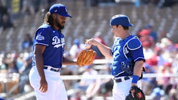 GLENDALE, ARIZONA - FEBRUARY 26: Kenley Jansen #74 of the Los Angeles Dodgers takes the ball from teammate Will Smith #16 during the first inning of a spring training game against the Los Angeles Angels at Camelback Ranch on February 26, 2020 in Glendale, Arizona. (Photo by Norm Hall/Getty Images)