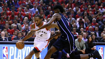 Kawhi Leonard #2 of the Toronto Raptors dribbles the ball as Jonathan Isaac #1 of the Orlando Magic defends during Game Two of the first round of the 2019 NBA Playoffs at Scotiabank Arena. (Photo by Vaughn Ridley/Getty Images)