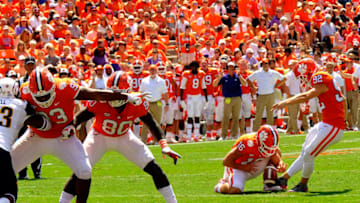 CLEMSON, SC - SEPTEMBER 2: Wide receiver Will Swinney holds the ball for kicker Greg Huegel