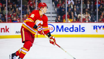 Nov 7, 2023; Calgary, Alberta, CAN; Calgary Flames defenseman Nikita Zadorov (16) controls the puck against the Nashville Predators during the third period at Scotiabank Saddledome. Mandatory Credit: Sergei Belski-USA TODAY Sports