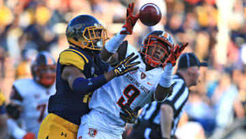 TOLEDO, OH - OCTOBER 15: Wide receiver Teo Redding #9 of the Bowling Green Falcons makes a catch during the third quarter while being defended by a Toledo Rockets defender at Glass Bowl on October 15, 2016 in Toledo, Ohio. (Photo by Andrew Weber/Getty Images)