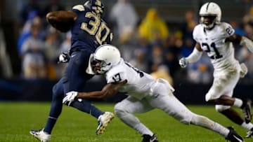 PITTSBURGH, PA - SEPTEMBER 08: Garrett Taylor #17 of the Penn State Nittany Lions tackles Qadree Ollison #30 of the Pittsburgh Panthers on September 8, 2018 at Heinz Field in Pittsburgh, Pennsylvania. (Photo by Justin K. Aller/Getty Images)
