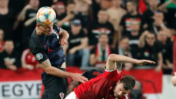 BUDAPEST, HUNGARY - MARCH 24: Dejan Lovren of Croatia battles for the ball in the air with Adam Szalai of Hungary during the 2020 UEFA European Championships group E qualifying match between Hungary and Croatia at Groupama Arena on March 24, 2019 in Budapest, Hungary. (Photo by Laszlo Szirtesi/Getty Images)