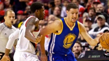 Nov 2, 2014; Portland, OR, USA; Golden State Warriors guard Klay Thompson (11) drives past Portland Trail Blazers guard Wesley Matthews (2) during the first quarter at the Moda Center. Mandatory Credit: Craig Mitchelldyer-USA TODAY Sports