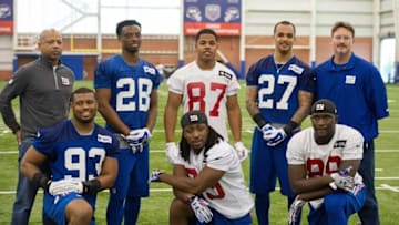 May 6, 2016; East Rutherford, NJ, USA; New Giants general manger Jerry Reese (back left), corner back Eli Apple (28), wide receiver Sterling Shepard (87), safety Darian Thompson (27), head coach Ben MaCadoo (back right), linebacker B.J. Goodson (93), running back Paul Perkins (39) and tight end Jerrell Adams (89) during rookie minicamp at Quest Diagnostics Training Center. Mandatory Credit: William Hauser-USA TODAY Sports