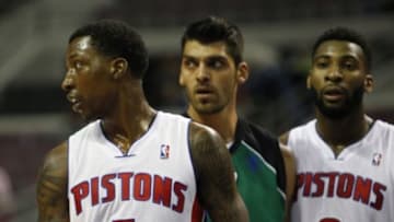 Oct 8, 2013; Auburn Hills, MI, USA; Detroit Pistons guard Kentavious Caldwell-Pope (5) looks to his right with Haifa center Alex Chubrevich (7) and Pistons center Andre Drummond (0) in the background during the second quarter at The Palace of Auburn Hills. Mandatory Credit: Raj Mehta-USA TODAY Sports