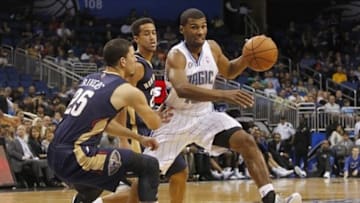 Oct 25, 2013; Orlando, FL, USA; Orlando Magic point guard Ronnie Price (10) drives past New Orleans Pelicans shooting guard Austin Rivers (25) during the first half at Amway Center. Mandatory Credit: Kim Klement-USA TODAY Sports