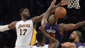Jan 3, 2016; Los Angeles, CA, USA; Phoenix Suns forward P.J. Tucker (17) battles for the ball with Los Angeles Lakers center Roy Hibbert (17) during the game at Staples Center. Mandatory Credit: Richard Mackson-USA TODAY Sports
