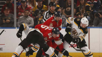 SUNRISE, FL - DECEMBER 14: Noel Acciari #55 of the Florida Panthers faces off against Brad Marchand #63 of the Boston Bruins at the BB&T Center on December 14, 2019 in Sunrise, Florida. (Photo by Eliot J. Schechter/NHLI via Getty Images)