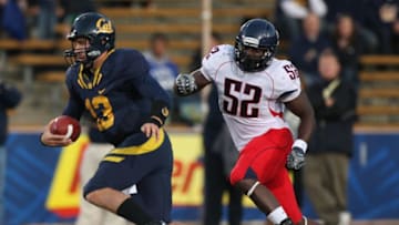 BERKELEY, CA - NOVEMBER 14: Kevin Riley #13 of the California Golden Bears runs against Sterling Lewis #52 of the Arizona Wildcats at California Memorial Stadium on November 14, 2009 in Berkeley, California. (Photo by Jed Jacobsohn/Getty Images)