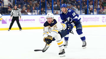 Nov 25, 2019; Tampa, FL, USA; Buffalo Sabres defenseman Rasmus Dahlin (26) skates with the puck as Tampa Bay Lightning left wing Ondrej Palat (18) defends during the second period at Amalie Arena. Mandatory Credit: Kim Klement-USA TODAY Sports
