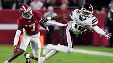 Oct 22, 2022; Tuscaloosa, Alabama, USA; Mississippi State Bulldogs wide receiver Justin Robinson (18) reaches for a pass against Alabama Crimson Tide defensive back Eli Ricks (7) at Bryant-Denny Stadium. Alabama won 30-6. Mandatory Credit: Gary Cosby Jr.-USA TODAY Sports