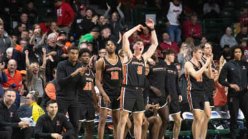 Members of the Princeton men's basketball team and their fans celebrate after Princeton defeated Rutgers.