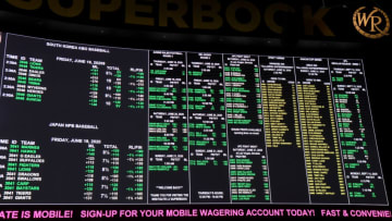 Betting lines are displayed at the Race & Sports SuperBook at the Westgate Las Vegas Resort & Casino, which features new screens on its entire 240-by-20 foot, 4,488-square-foot HD video layout, after the property opened for the first time since being closed in mid-March because of the coronavirus (COVID-19) pandemic on June 18, 2020 in Las Vegas, Nevada. Hotel-casinos throughout the state were allowed to open on June 4 as part of a phased reopening of the economy with social distancing guidelines and other restrictions in place. The Westgate, which first opened as the International in 1969, had planned to reopen with designated non-smoking, mask-required table games over half of its casino floor, as well as designated mask-required elevators. On Wednesday, citing updated guidance from the Centers for Disease Control and Prevention, the Nevada Gaming Control Board issued an industry notice updating its health and safety policy. It dictates that all players at table and card games must wear face coverings if there is no barrier between the dealer and each player. The policy applies to spectators or anyone else within six feet of a game. Also, properties must offer face masks or cloth coverings to guests as they enter the casino or have dedicated signage alerting patrons that they are available. (Photo by Ethan Miller/Getty Images)