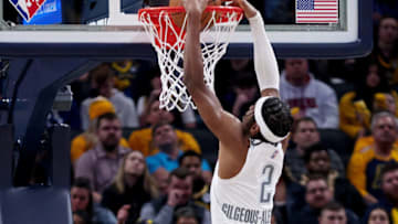 Shai Gilgeous-Alexander #2 of the Oklahoma City Thunder dunks the ball in the fourth quarter against the Indiana Pacers at Gainbridge Fieldhouse on February 25, 2022 in Indianapolis, Indiana. NOTE TO USER: User expressly acknowledges and agrees that, by downloading and or using this Photograph, user is consenting to the terms and conditions of the Getty Images License Agreement. (Photo by Dylan Buell/Getty Images)