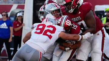 Sep 2, 2023; Bloomington, Indiana, USA; Ohio State Buckeyes defensive end Caden Curry (92) and defensive tackle Hero Kanu (93) tackle Indiana Hoosiers quarterback Brendan Sorsby (15) during the NCAA football game at Indiana University Memorial Stadium. Ohio State won 23-3.