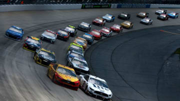 DOVER, DE - MAY 06: Brad Keselowski, driver of the #2 Miller Lite Ford, leads the field during a restart for the Monster Energy NASCAR Cup Series Gander RV 400 at Dover International Speedway on May 6, 2019 in Dover, Delaware. (Photo by Sean Gardner/Getty Images)