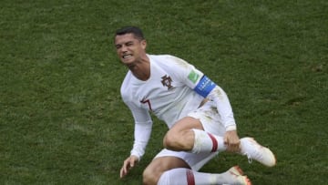 Portugal's forward Cristiano Ronaldo (R) reacts following a challenge during the Russia 2018 World Cup Group B football match between Portugal and Morocco at the Luzhniki Stadium in Moscow on June 20, 2018. (Photo by Juan Mabromata / AFP) / RESTRICTED TO EDITORIAL USE - NO MOBILE PUSH ALERTS/DOWNLOADS (Photo credit should read JUAN MABROMATA/AFP/Getty Images)