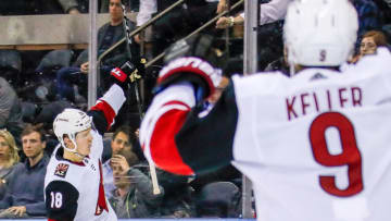 NEW YORK, NY - OCTOBER 22: Arizona Coyotes left wing Christian Dvorak (18) celebrates winning overtime goal with Arizona Coyotes center Clayton Keller (9) during the Arizona Coyotes and New York Rangers NHL game on October 22, 2019, at Madison Square Garden in New York, NY. (Photo by John Crouch/Icon Sportswire via Getty Images)