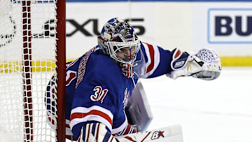 NEW YORK, NEW YORK - FEBRUARY 16: Igor Shesterkin #31 of the New York Rangers clears the puck in the first period against the New Jersey Devils at Madison Square Garden on February 16, 2021 in New York City. (Photo by Elsa/Getty Images)