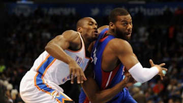 Apr 16, 2014; Oklahoma City, OK, USA; Detroit Pistons forward Greg Monroe (10) drives to the basket against Oklahoma City Thunder forward Serge Ibaka (9) during the first quarter at Chesapeake Energy Arena. Mandatory Credit: Mark D. Smith-USA TODAY Sports