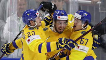 COPENHAGEN, DENMARK - MAY 15, 2018: Sweden's Oliver Ekman-Larsson, Mika Zibanejad, Rickard Rakell (L-R) celebrate scoring in the 2018 IIHF World Championship Preliminary Round Group A ice hockey match against Russia at Royal Arena. Anton Novoderezhkin/TASS (Photo by Anton NovoderezhkinTASS via Getty Images)