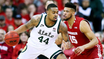 MADISON, WISCONSIN - FEBRUARY 12: Nick Ward #44 of the Michigan State Spartans dribbles the ball while being guarded by Charles Thomas IV #15 of the Wisconsin Badgers in the first half at the Kohl Center on February 12, 2019 in Madison, Wisconsin. (Photo by Dylan Buell/Getty Images)