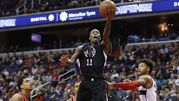 Dec 28, 2015; Washington, DC, USA; Los Angeles Clippers guard Jamal Crawford (11) shoots the ball as Washington Wizards forward Kelly Oubre Jr. (12) looks on in the second quarter at Verizon Center. Mandatory Credit: Geoff Burke-USA TODAY Sports