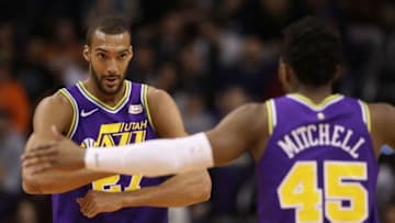 PHOENIX, ARIZONA - MARCH 13: Rudy Gobert #27 of the Utah Jazz is congratulated by Donovan Mitchell #45 after scoring against the Phoenix Suns during the first half of the NBA game at Talking Stick Resort Arena on March 13, 2019 in Phoenix, Arizona. (Photo by Christian Petersen/Getty Images)