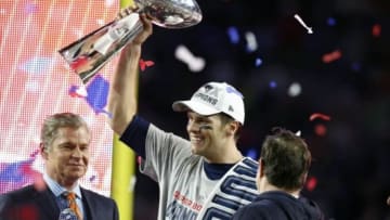 Feb 1, 2015; Glendale, AZ, USA; New England Patriots quarterback Tom Brady (12) celebrates with the Vince Lombardi Trophy after beating the Seattle Seahawks in Super Bowl XLIX at University of Phoenix Stadium. Mandatory Credit: Matthew Emmons-USA TODAY Sports