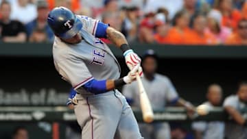 Aug 4, 2016; Baltimore, MD, USA; Texas Rangers outfielder Ian Desmond (20) hits an RBI ground out in the third inning against the Baltimore Orioles at Oriole Park at Camden Yards. Mandatory Credit: Evan Habeeb-USA TODAY Sports
