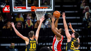 Ohio State forward Zed Key (23) makes a basket as Iowa's Joe Wieskamp (10) and Iowa center Luka Garza, right, defend during a NCAA Big Ten Conference men's basketball game, Thursday, Feb. 4, 2021, at Carver-Hawkeye Arena in Iowa City, Iowa.210204 Ohio St Iowa Mbb 006 Jpg
