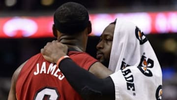 Jan 17, 2014; Philadelphia, PA, USA; Miami Heat guard Dwyane Wade (3) talks with forward LeBron James (6) during the fourth quarter against the Philadelphia 76ers at the Wells Fargo Center. The Heat defeated the Sixers 101-86. Mandatory Credit: Howard Smith-USA TODAY Sports