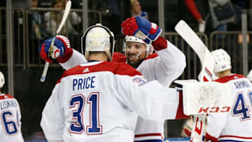 NEW YORK, NY - DECEMBER 06: Nate Thompson #44 and Carey Price #31 of the Montreal Canadiens celebrate after defeating the New York Rangers 2-1 at Madison Square Garden on December 6, 2019 in New York City. (Photo by Jared Silber/NHLI via Getty Images)