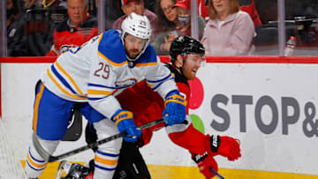NEWARK, NEW JERSEY - OCTOBER 23: Vinnie Hinostroza #29 of the Buffalo Sabres plays the puck during the third period against Dougie Hamilton #7 of the New Jersey Devils at Prudential Center on October 23, 2021 in Newark, New Jersey. (Photo by Jim McIsaac/Getty Images)