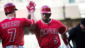 SEATTLE, WA - JUNE 11: Albert Pujols #5 of the Los Angeles Angels of Anaheim is greeted by Zack Cozart #7 after hitting a home run in the first inning off of Wade LeBlanc #49 of the Seattle Mariners at Safeco Field on June 11, 2018 in Seattle, Washington. (Photo by Lindsey Wasson/Getty Images)