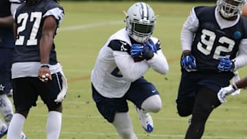Jun 14, 2016; Irving, TX, USA; Dallas Cowboys running back Ezekiel Elliott (21) runs with the ball during minicamp at Dallas Cowboys Headquarters. Mandatory Credit: Matthew Emmons-USA TODAY Sports