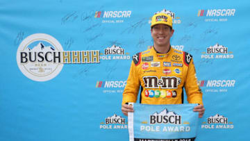 MARTINSVILLE, VA - OCTOBER 27: Kyle Busch, driver of the #18 M&M's Halloween Toyota, poses with the Busch Pole Award after posting the fastest lap during qualifying for the Monster Energy NASCAR Cup Series First Data 500 at Martinsville Speedway on October 27, 2018 in Martinsville, Virginia. (Photo by Brian Lawdermilk/Getty Images)