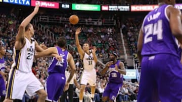 Apr 8, 2015; Salt Lake City, UT, USA; Utah Jazz guard Dante Exum (11) throws the ball up to the basket with the shot clock winding down during the third quarter against the Sacramento Kings at EnergySolutions Arena. Utah Jazz on the game 103-91. Mandatory Credit: Chris Nicoll-USA TODAY Sports