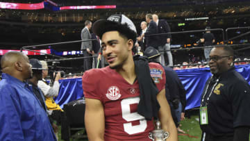 Dec 31, 2022; New Orleans, LA, USA; Alabama quarterback Bryce Young (9) carries away the MVP trophy after throwing five touchdown passes during the 2022 Sugar Bowl at Caesars Superdome. Alabama defeated Kansas State 45-20. Mandatory Credit: Gary Cosby Jr.-USA TODAY Sports